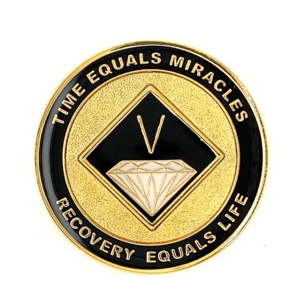 A gold and black coin with the words time equals miracles, recovery equals life.