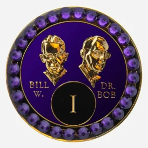 Purple AA medallion with crystal AB accents, featuring stylized busts of Bill W. and Dr. Bob, commemorating sobriety.