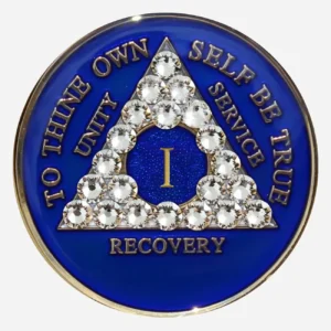This Crystal AA Medallion shimmers with serenity. The blue Swarovski crystals and delicate diamond accents create a calming presence, reflecting the peace found in recovery.