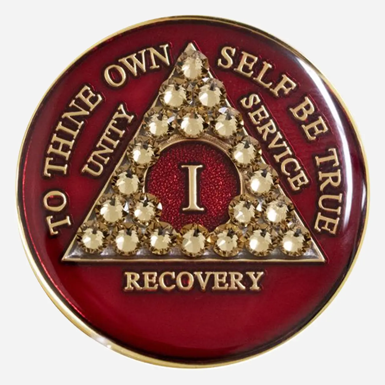 This Crystal AA Medallion features bold red and gold Swarovski crystals, symbolizing the courage and strength needed to overcome challenges and embrace recovery.