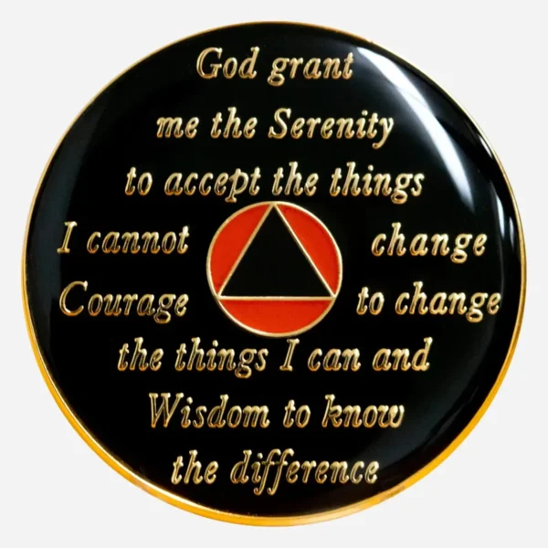 The Serenity Prayer is boldly displayed in orange on this black Triplate AA Token, serving as a powerful reminder of the principles of recovery.