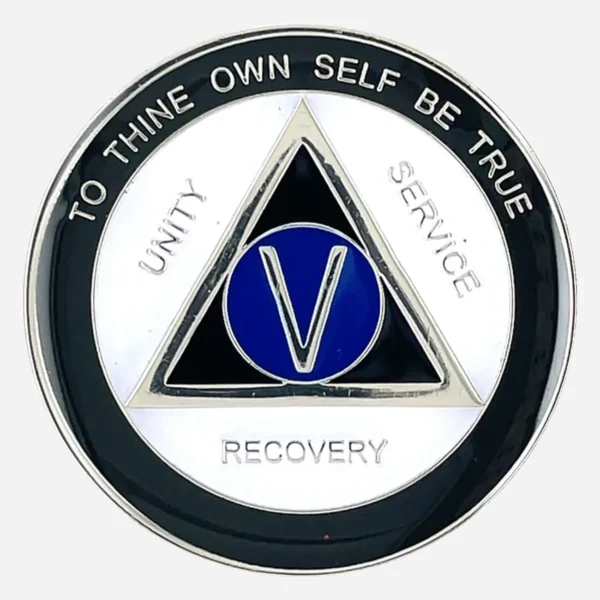 A distinctive AA sobriety medallion (approximately 34mm) featuring a bold black outer enamel ring and a crisp white inner ring. The center prominently displays a blue AA circle and triangle symbol, surrounded by the words 'Unity,' 'Service,' and 'Recovery.' The outer edge includes 'To Thine Own Self Be True' and the sobriety anniversary year (in Roman numerals, 1-40 years). The token has a smooth, glossy finish that highlights its contrasting colors.
